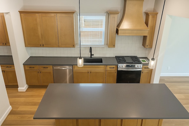 2519 S Houston Ave, Pearland, TX 77581 - kitchen featuring appliances with stainless steel finishes, premium range hood, dark countertops, light wood finished floors, and backsplash