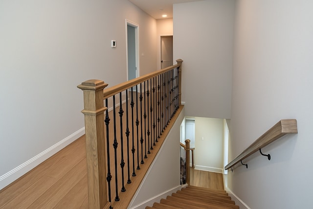 2519 S Houston Ave, Pearland, TX 77581 - staircase featuring wood finished floors and recessed lighting