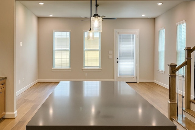 2519 S Houston Ave, Pearland, TX 77581 - unfurnished dining area featuring a ceiling fan, light wood-style flooring, stairs, and recessed lighting