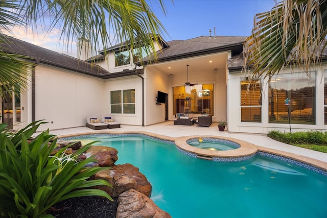 5214 Bristol Bank Ct, Houston, TX 77041 - pool at dusk with outdoor lounge area, ceiling fan, a patio area, and a pool with connected hot tub