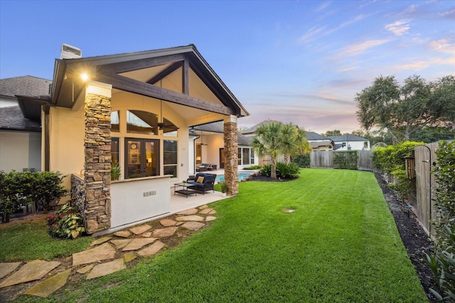 5214 Bristol Bank Ct, Houston, TX 77041 - rear view of house with a patio area, a fenced backyard, ceiling fan, a chimney, and an outdoor living space