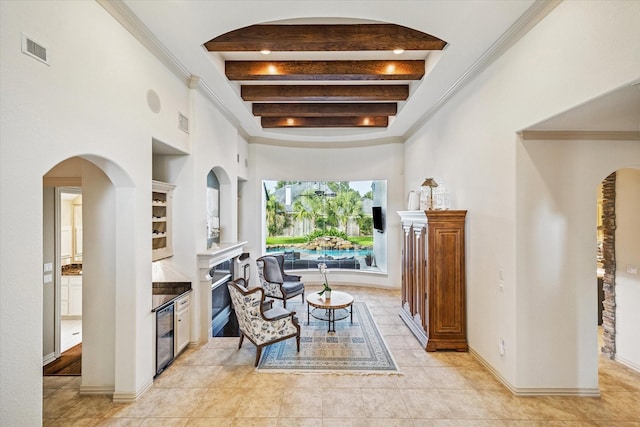 5214 Bristol Bank Ct, Houston, TX 77041 - sitting room with beam ceiling, built in shelves, a fireplace, light tile patterned flooring, and arched walkways