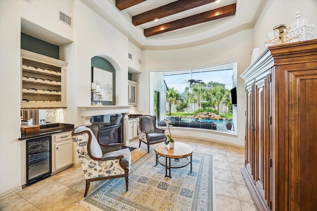 5214 Bristol Bank Ct, Houston, TX 77041 - sitting room with beverage cooler, a high ceiling, beam ceiling, light tile patterned floors, and ornamental molding