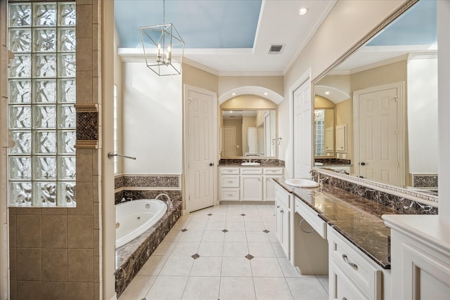 5214 Bristol Bank Ct, Houston, TX 77041 - bathroom with ornamental molding, a tub with jets, two vanities, a chandelier, and tile patterned flooring