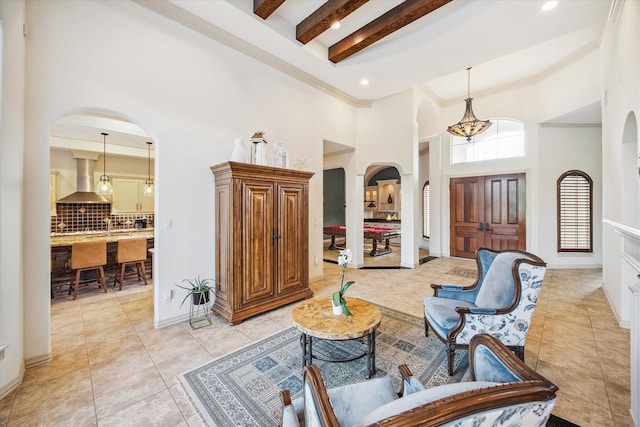 5214 Bristol Bank Ct, Houston, TX 77041 - entryway with arched walkways, a towering ceiling, beamed ceiling, light tile patterned floors, and a chandelier