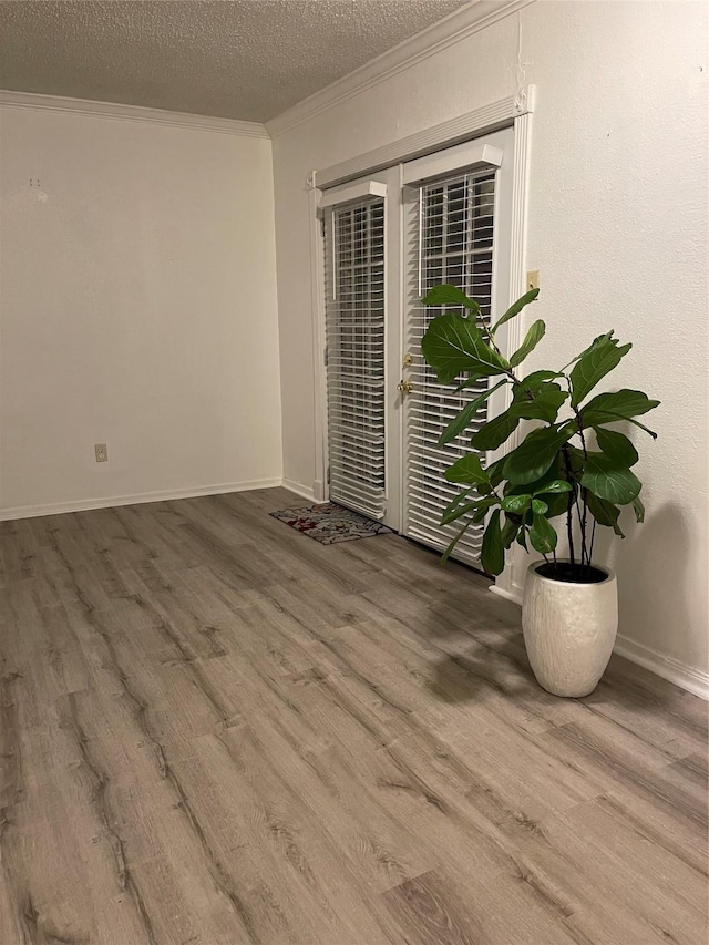 6101 Maywood Dr, Houston, TX 77053 - unfurnished room featuring crown molding, wood finished floors, and a textured ceiling
