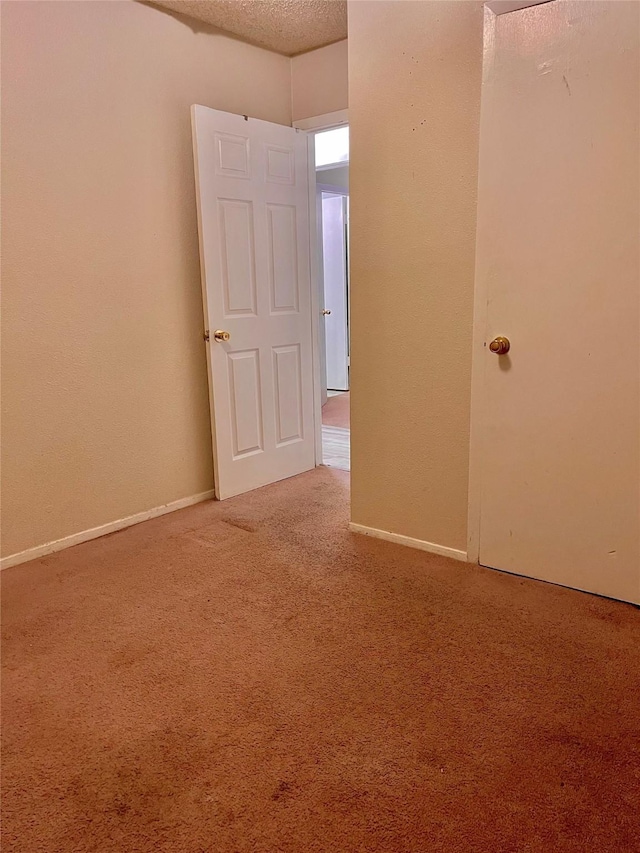 6101 Maywood Dr, Houston, TX 77053 - empty room featuring carpet flooring and a textured ceiling