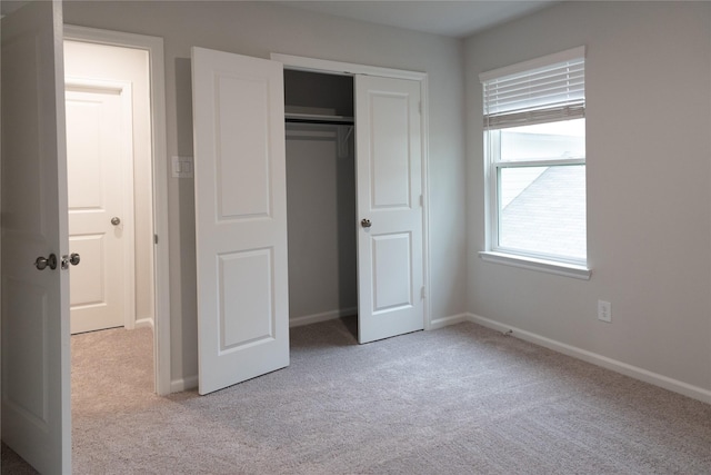 64 Valiant Ridge Trl, Magnolia, TX 77354 - unfurnished bedroom featuring carpet flooring and a closet
