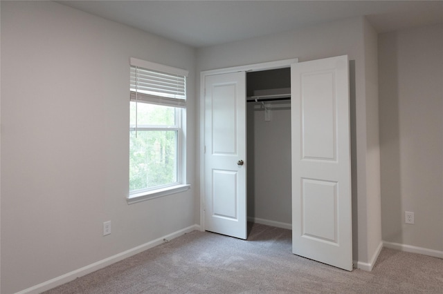 64 Valiant Ridge Trl, Magnolia, TX 77354 - unfurnished bedroom with light carpet and a closet
