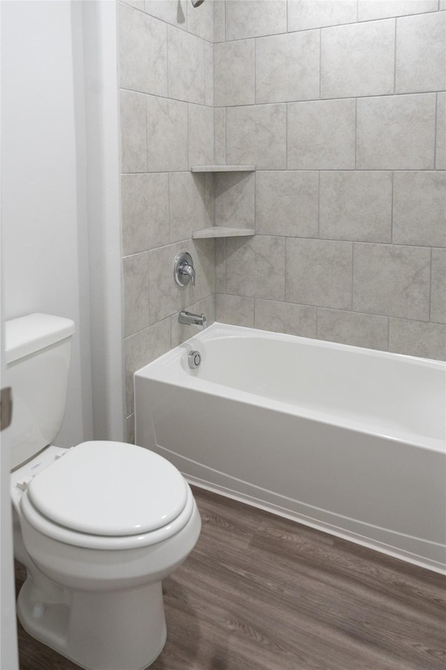 64 Valiant Ridge Trl, Magnolia, TX 77354 - bathroom featuring wood finished floors and shower / bathtub combination