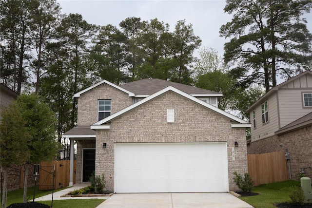 64 Valiant Ridge Trl, Magnolia, TX 77354 - view of front facade featuring concrete driveway, stone siding, and an attached garage