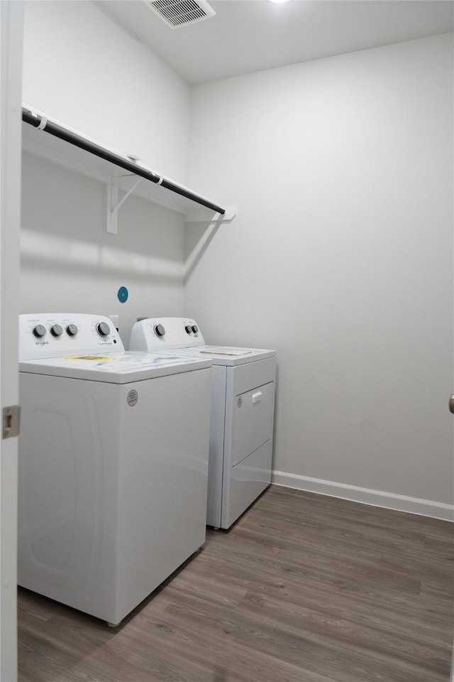 64 Valiant Ridge Trl, Magnolia, TX 77354 - laundry area with separate washer and dryer and wood finished floors