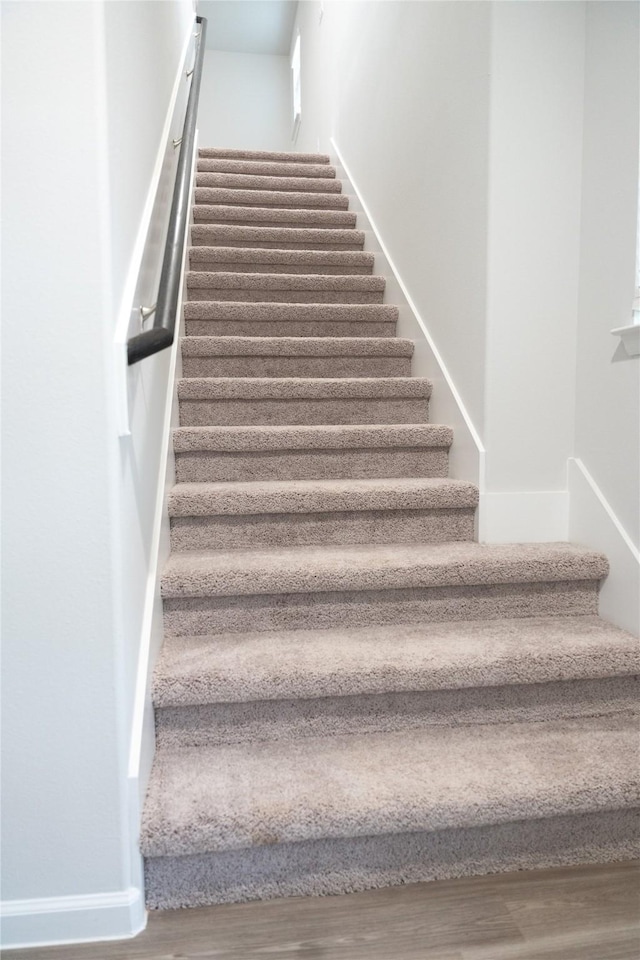 64 Valiant Ridge Trl, Magnolia, TX 77354 - stairs with wood finished floors