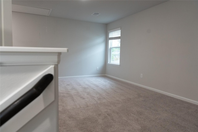 64 Valiant Ridge Trl, Magnolia, TX 77354 - unfurnished living room featuring attic access and light colored carpet