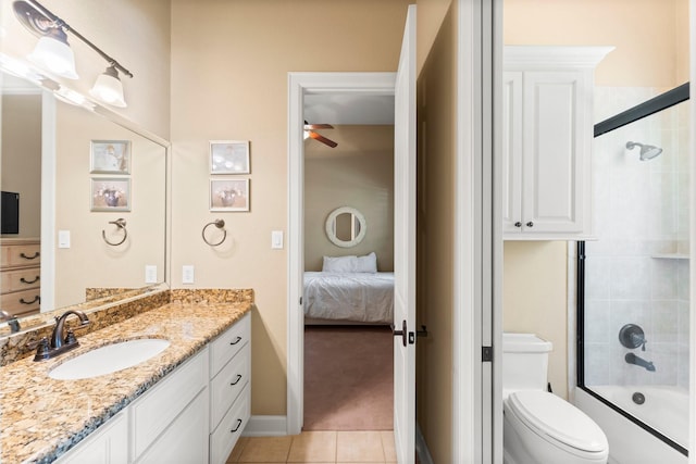 4022 Hidden Winds Dr, Spring, TX 77386 - ensuite bathroom featuring vanity, a ceiling fan, tile patterned flooring, and bath / shower combo with glass door