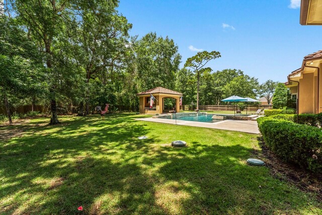 4022 Hidden Winds Dr, Spring, TX 77386 - fenced backyard featuring a gazebo, a patio, and an outdoor pool