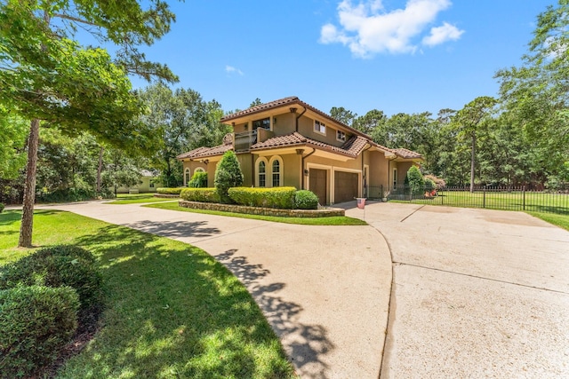 4022 Hidden Winds Dr, Spring, TX 77386 - mediterranean / spanish home with stucco siding, concrete driveway, and a tile roof