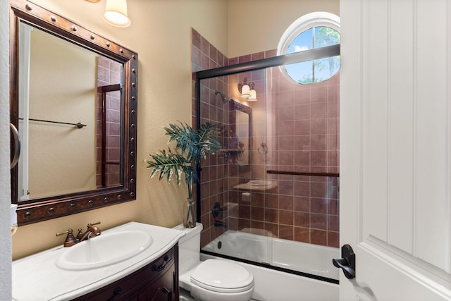 4022 Hidden Winds Dr, Spring, TX 77386 - full bathroom featuring a textured wall, vanity, and bath / shower combo with glass door