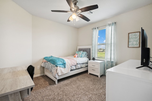 7910 Brooks Crossing Dr, Baytown, TX 77521 - carpeted bedroom featuring a ceiling fan and a desk