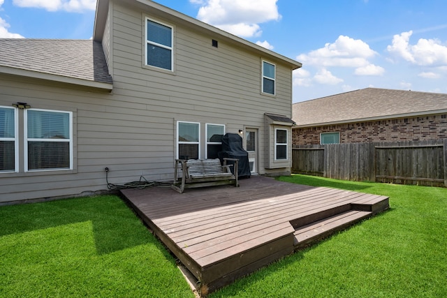 7910 Brooks Crossing Dr, Baytown, TX 77521 - rear view of property featuring a fenced backyard and a wooden deck