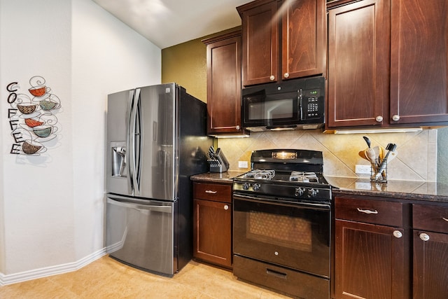 7910 Brooks Crossing Dr, Baytown, TX 77521 - kitchen featuring black appliances, tasteful backsplash, and dark stone countertops