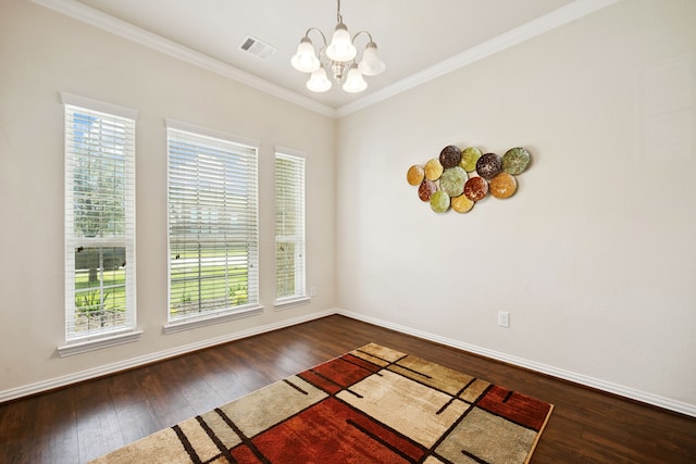 7910 Brooks Crossing Dr, Baytown, TX 77521 - spare room featuring a chandelier, dark wood-style floors, and ornamental molding