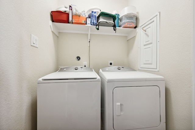 7910 Brooks Crossing Dr, Baytown, TX 77521 - washroom featuring washer and dryer and a textured wall