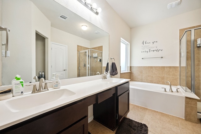 7910 Brooks Crossing Dr, Baytown, TX 77521 - full bath with a stall shower, double vanity, a bath, and tile patterned floors