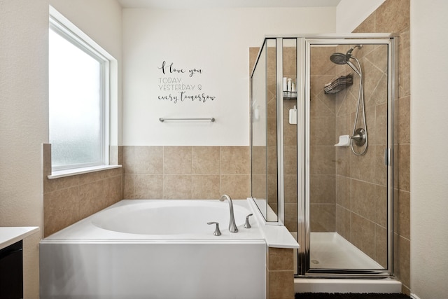 7910 Brooks Crossing Dr, Baytown, TX 77521 - full bath with a garden tub, a stall shower, and vanity