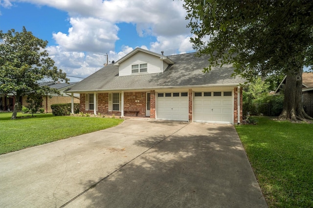 2718 Stratford St, Pearland, TX 77581 - traditional-style home featuring brick siding, an attached garage, a front yard, and driveway