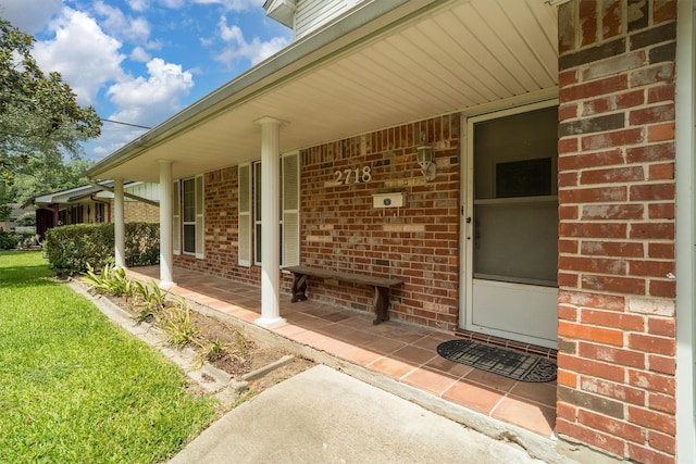 2718 Stratford St, Pearland, TX 77581 - entrance to property featuring brick siding, a porch, and a lawn