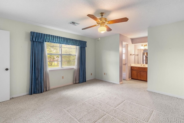 2718 Stratford St, Pearland, TX 77581 - unfurnished bedroom with light carpet, ensuite bathroom, ceiling fan, a chandelier, and a textured ceiling