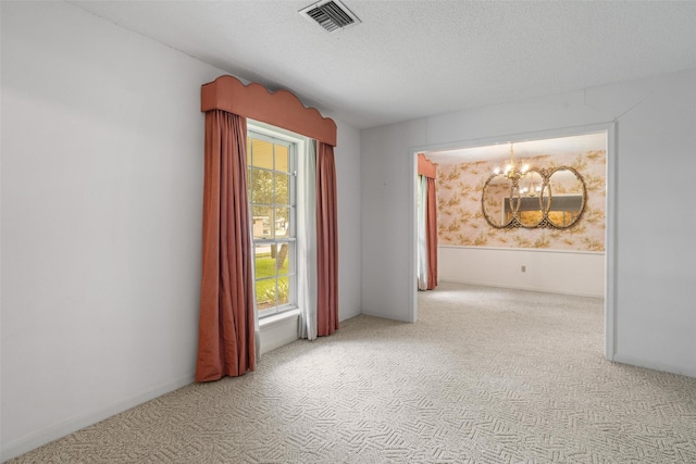 2718 Stratford St, Pearland, TX 77581 - carpeted spare room featuring a chandelier and a textured ceiling