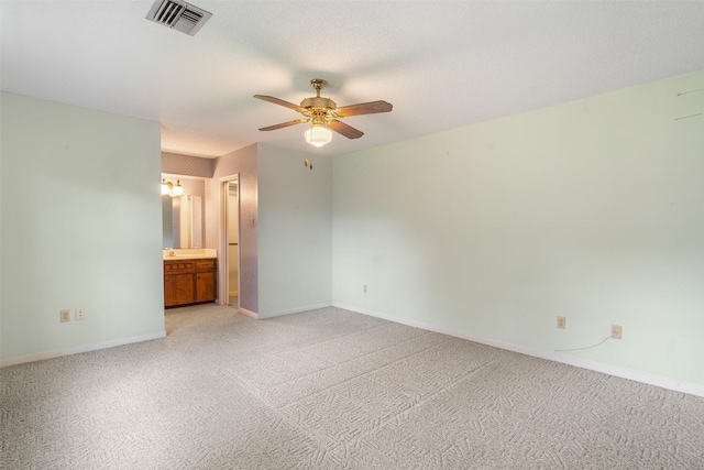 2718 Stratford St, Pearland, TX 77581 - unfurnished bedroom featuring light carpet, ensuite bath, and a ceiling fan