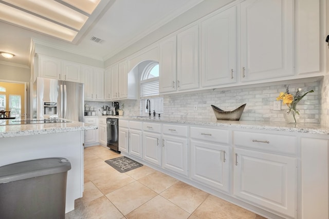 4106 Alice Dr, Sugar Land, TX 77478 - kitchen featuring black appliances, crown molding, healthy amount of natural light, and white cabinets
