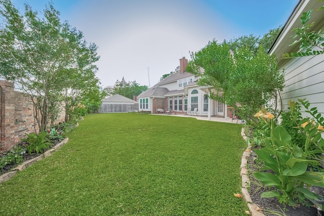4106 Alice Dr, Sugar Land, TX 77478 - fenced backyard with a patio