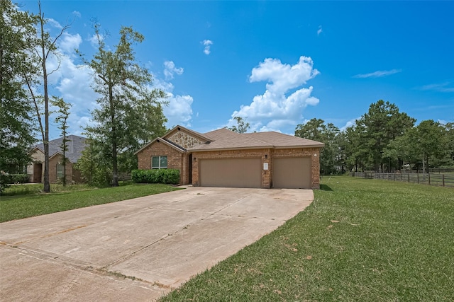 9198 Sierra Del Carmen, Conroe, TX 77303 - view of front of home with brick siding, a garage, and concrete driveway