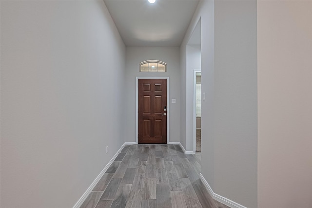 9198 Sierra Del Carmen, Conroe, TX 77303 - doorway to outside featuring wood finished floors and baseboards
