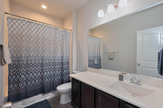 9198 Sierra Del Carmen, Conroe, TX 77303 - bathroom featuring vanity, shower / tub combo with curtain, and recessed lighting