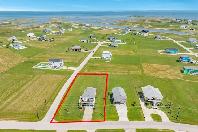 18614 Warrior Rd, Galveston, TX 77554 - aerial view of property and surrounding area with property parcel outlined and a large body of water