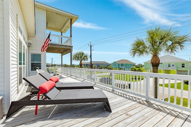 18614 Warrior Rd, Galveston, TX 77554 - wooden deck featuring a residential view