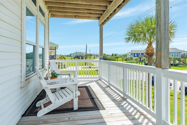 18614 Warrior Rd, Galveston, TX 77554 - wooden deck with a residential view