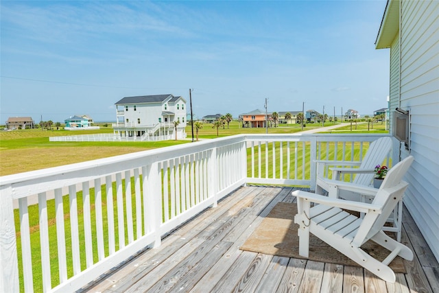 18614 Warrior Rd, Galveston, TX 77554 - wooden terrace featuring a residential view and a lawn