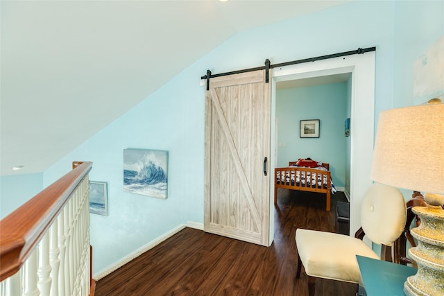 18614 Warrior Rd, Galveston, TX 77554 - sitting room with a barn door, wood finished floors, and vaulted ceiling