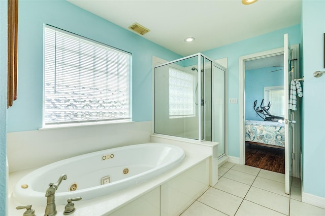 18614 Warrior Rd, Galveston, TX 77554 - full bathroom with a shower stall, ensuite bath, a tub with jets, and tile patterned flooring