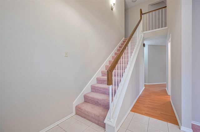 2415 Pebbledowne Cir, Sugar Land, TX 77478 - stairway with tile patterned floors and baseboards