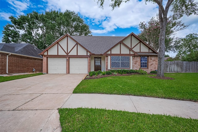 2415 Pebbledowne Cir, Sugar Land, TX 77478 - tudor home with a garage, driveway, stucco siding, and brick siding