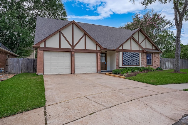 2415 Pebbledowne Cir, Sugar Land, TX 77478 - tudor-style house featuring a garage, brick siding, driveway, and roof with shingles