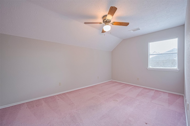 2415 Pebbledowne Cir, Sugar Land, TX 77478 - bonus room featuring light colored carpet, vaulted ceiling, a ceiling fan, and a textured ceiling