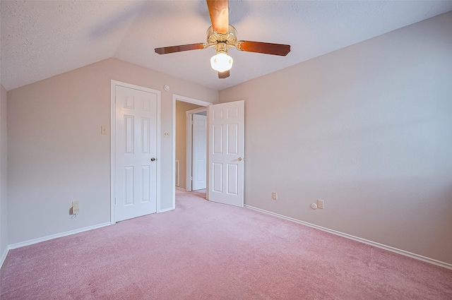 2415 Pebbledowne Cir, Sugar Land, TX 77478 - unfurnished bedroom with light colored carpet, lofted ceiling, and a ceiling fan
